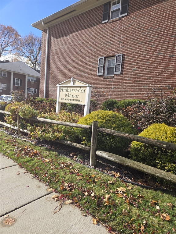 25 Arlington Road, Unit 11 Woburn, MA 01801 - Photo 2 of 14 front view of a house with a yard