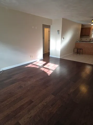 a view of a livingroom with wooden floor