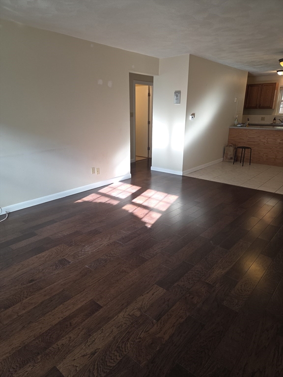 25 Arlington Road, Unit 11 Woburn, MA 01801 - Photo 5 of 14 a view of a livingroom with wooden floor