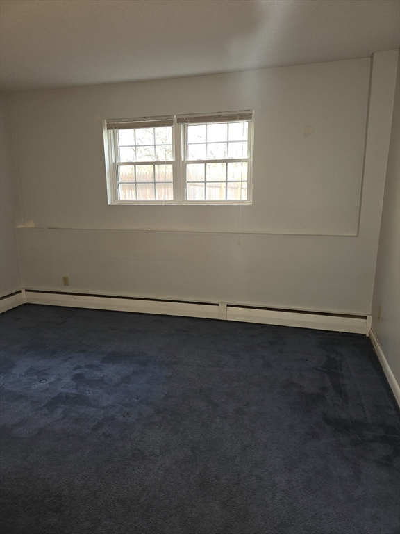 25 Arlington Road, Unit 11 Woburn, MA 01801 - Photo 7 of 14 an empty room with a window