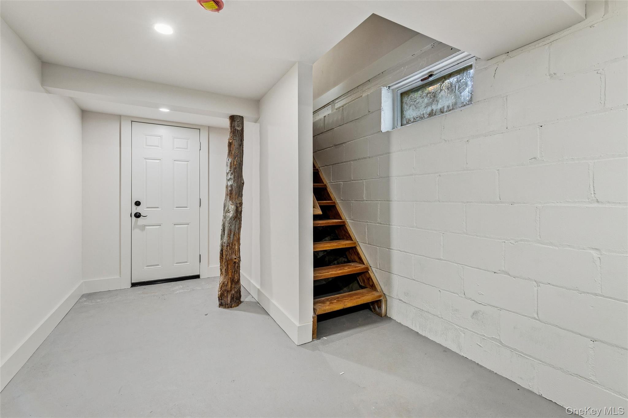 335 Herricks Lane, Unit A Jamesport, NY 11901 - Photo 15 of 18 a view of entryway with stairs