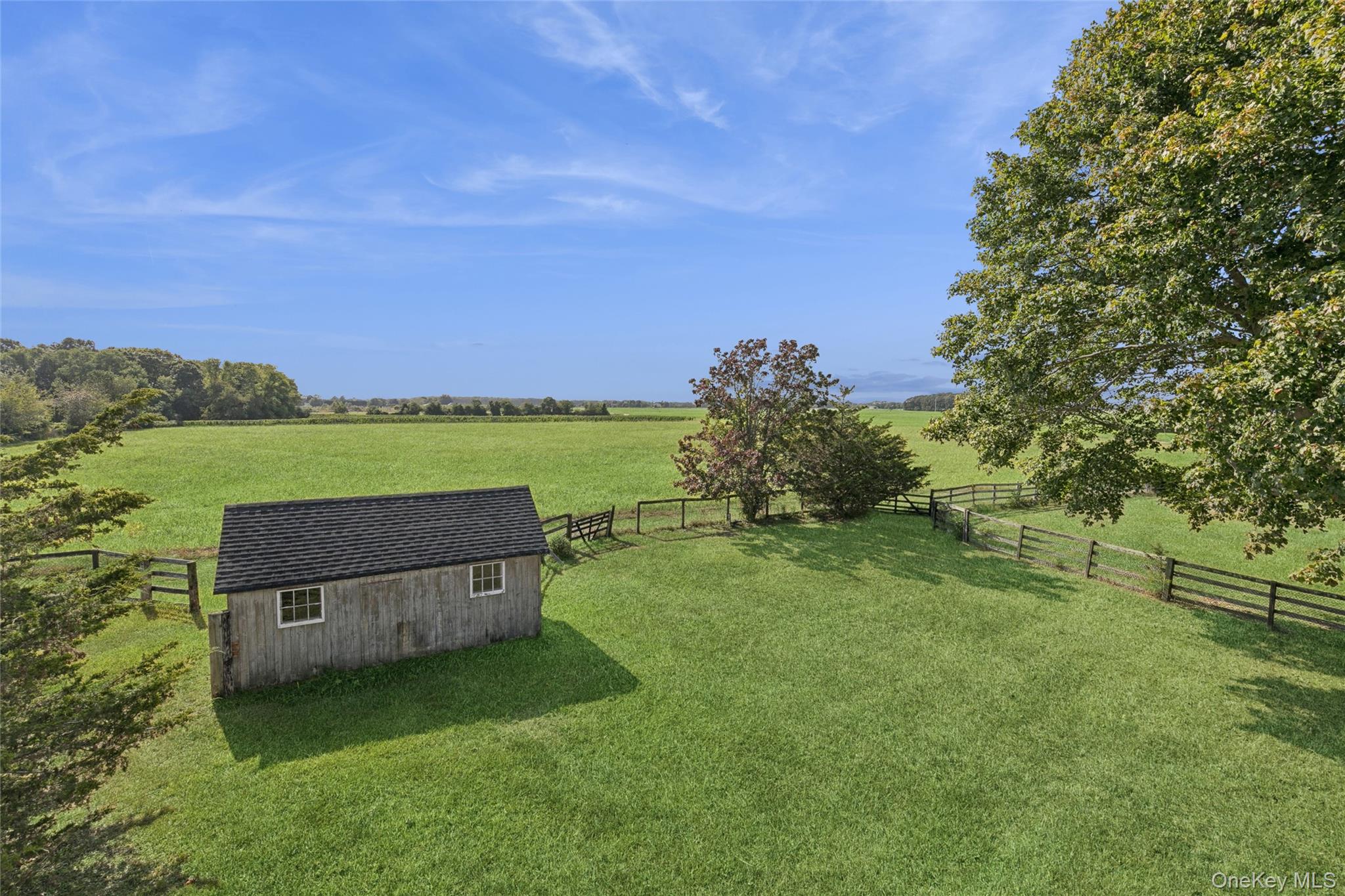 335 Herricks Lane, Unit A Jamesport, NY 11901 - Photo 18 of 18 a backyard of a house with a yard and outdoor seating