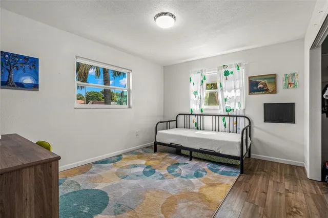 a view of a livingroom with furniture and wooden floor