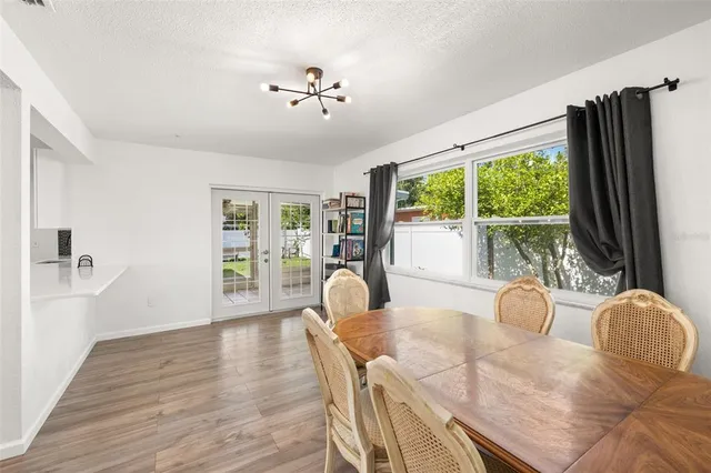 a view of a dining room with furniture window and outside view