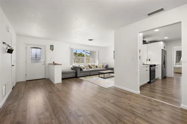 a view of a livingroom with furniture and wooden floor