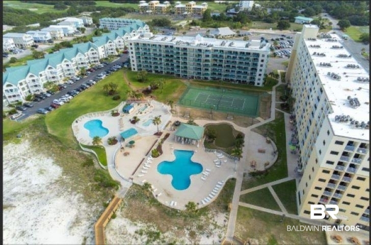 645 Plantation Road, Unit 6503 Gulf Shores, AL 36542 - Photo 1 of 53 Aerial view of property and surrounding area featuring a pool area and apartment complex / building