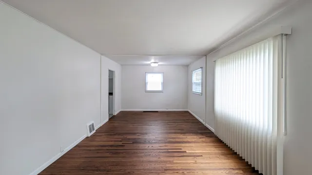 a view of an empty room and window
