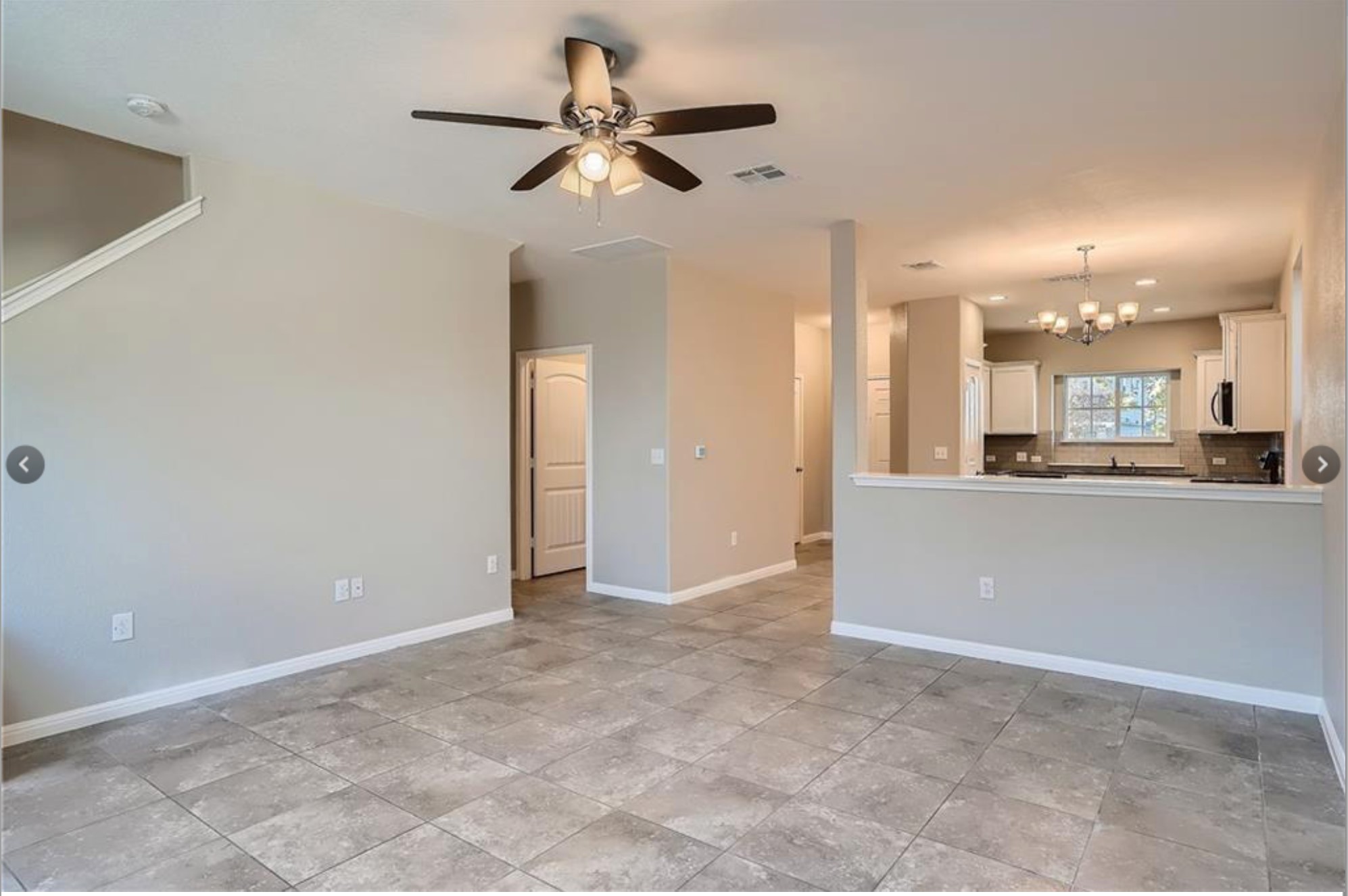 304 Cane River Road Pflugerville, TX 78660 - Photo 30 of 31 An open floorplan seamlessly connects the living area to a modern kitchen, creating an inviting atmosphere.