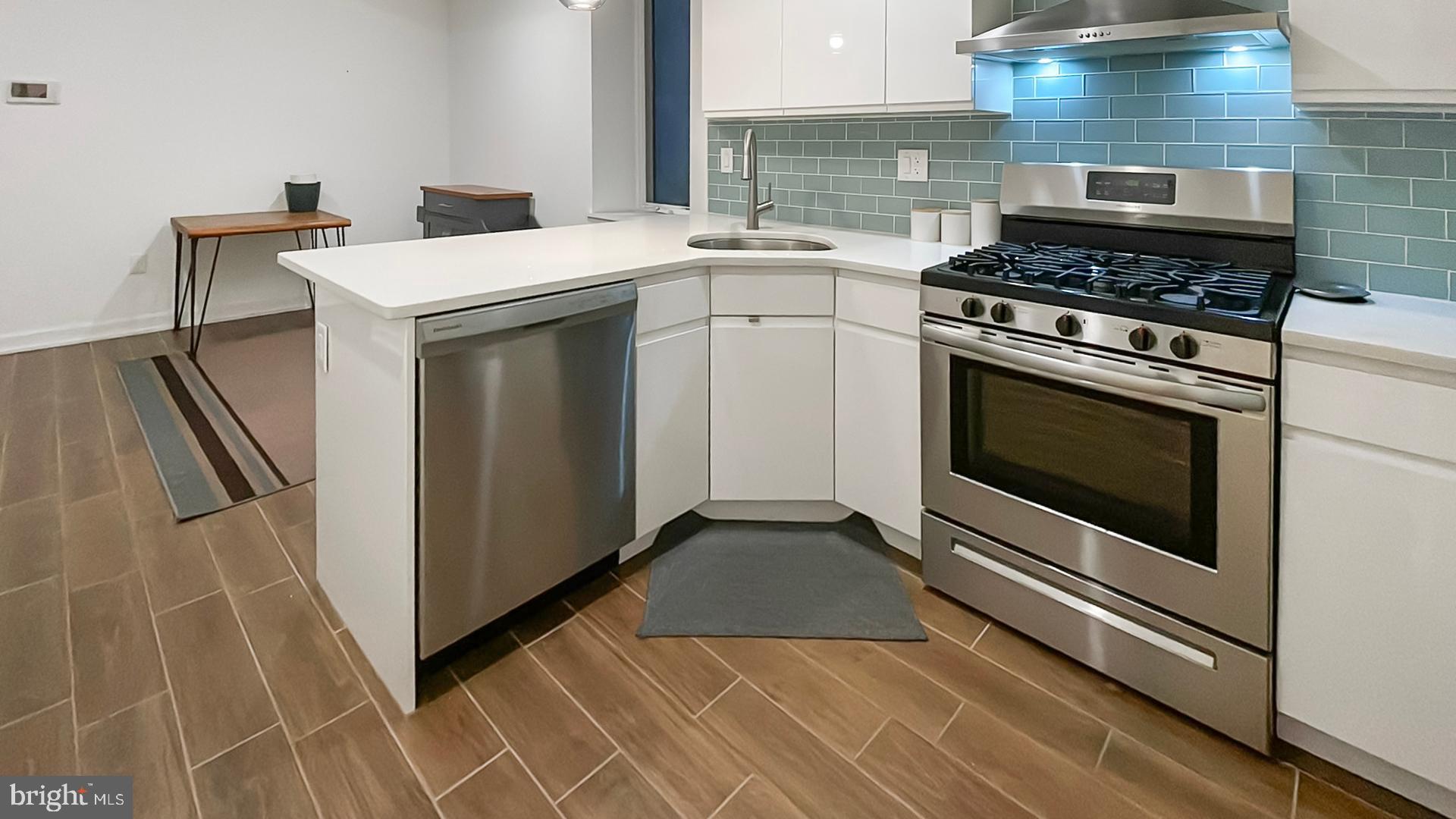 4727 Walnut Street, Unit 4 Philadelphia, PA 19139 - Photo 13 of 26 a kitchen with a stove and a sink