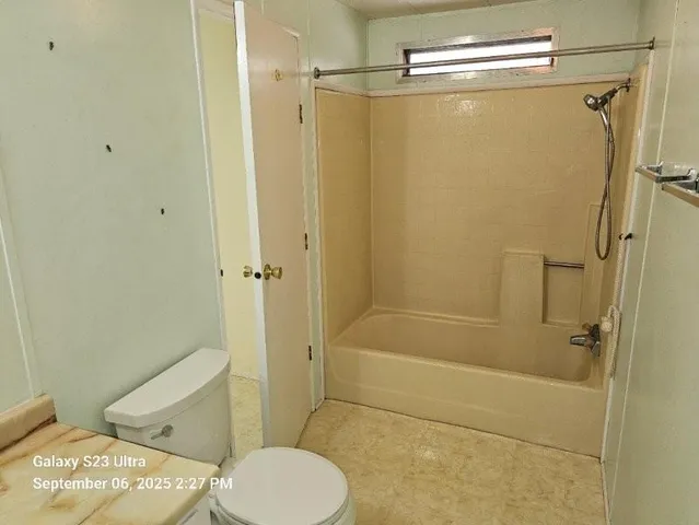 a view of a room with a ceiling fan