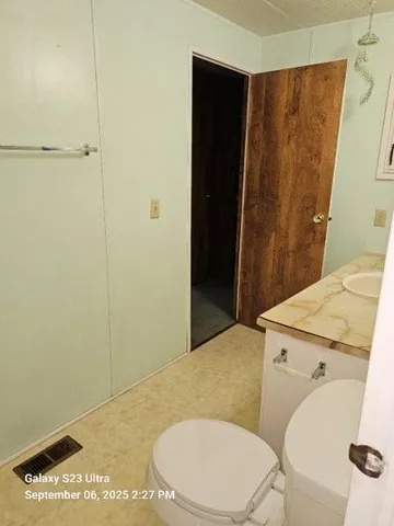 a view of a closet and wooden floor