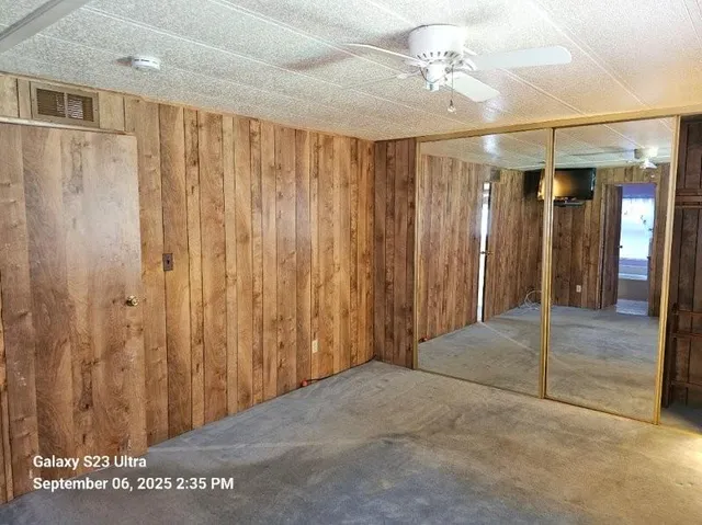 a kitchen with granite countertop white cabinets and a sink