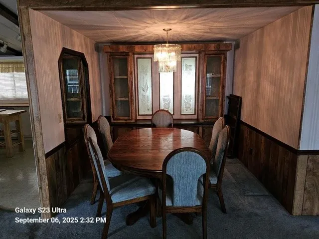 a kitchen with a sink appliances and cabinets