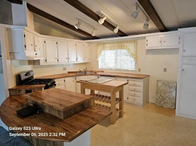 a kitchen with a sink and cabinets