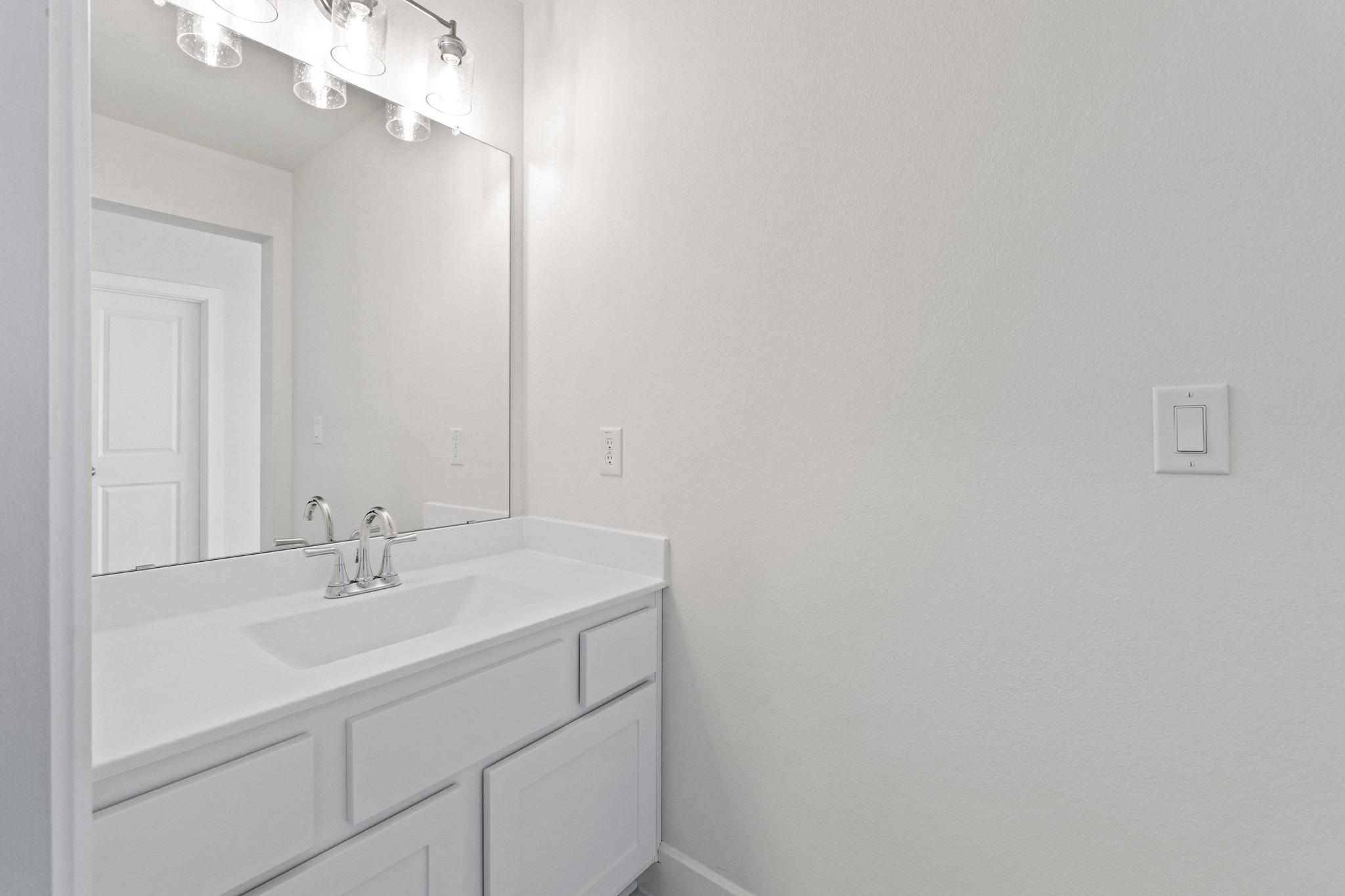 604 Lightstone Drive Georgetown, TX 78633 - Photo 28 of 39 a bathroom with a sink and a mirror