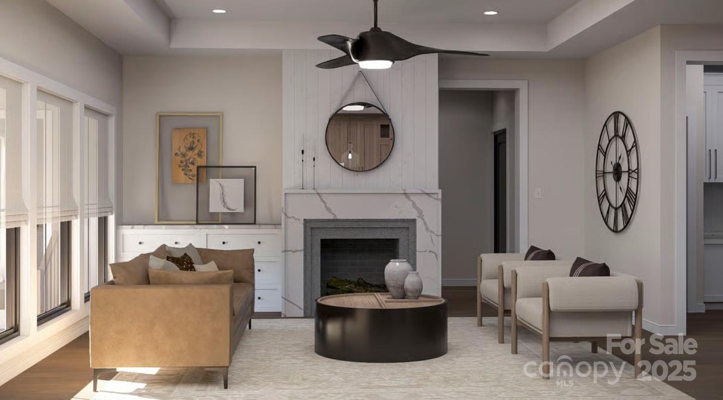 1246 Houston Mill Road Conover, NC 28613 - Photo 5 of 5 a living room with furniture a fireplace and a chandelier