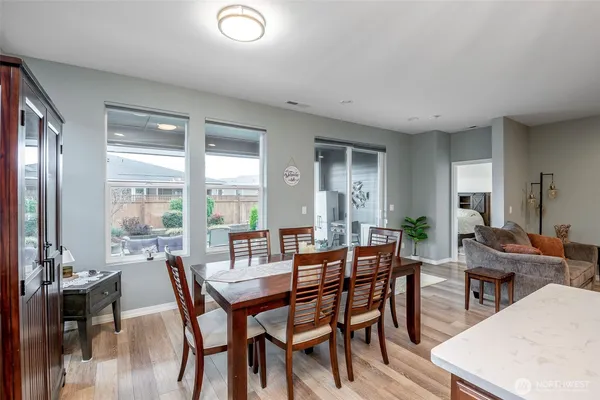 a view of a dining room with furniture window and outside view