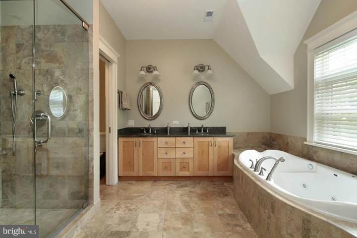 13000 Wainwright Road Highland, MD 20777 - Photo 7 of 11 a view of bathroom with bathtub mirror and window