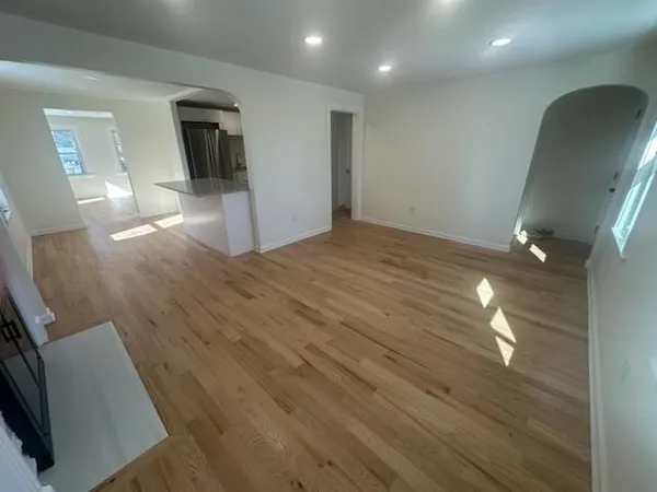 a view of a livingroom with wooden floor