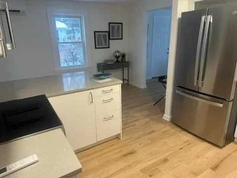 a kitchen with a refrigerator stove and a sink