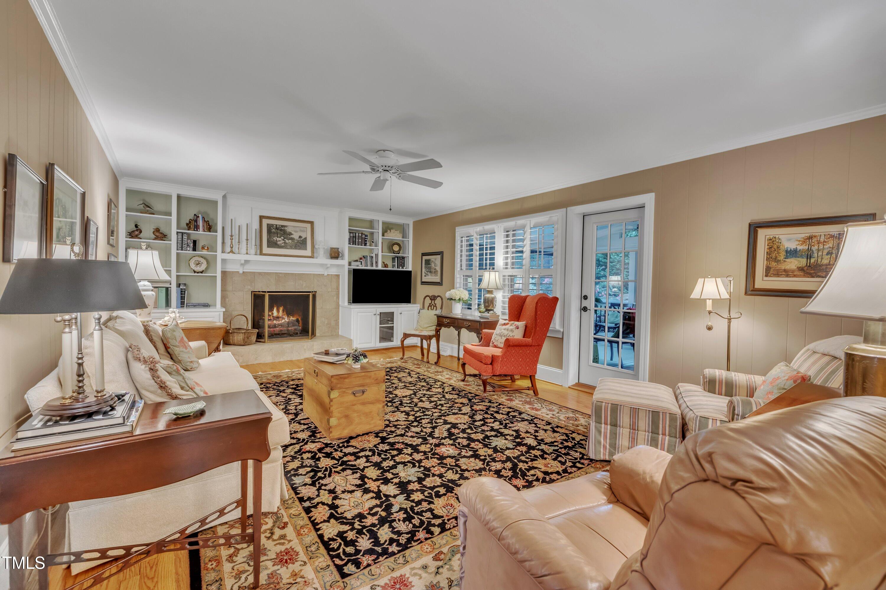 2013 Eagleton Circle Raleigh, NC 27609 - Photo 13 of 62 a living room with furniture large window and a fireplace