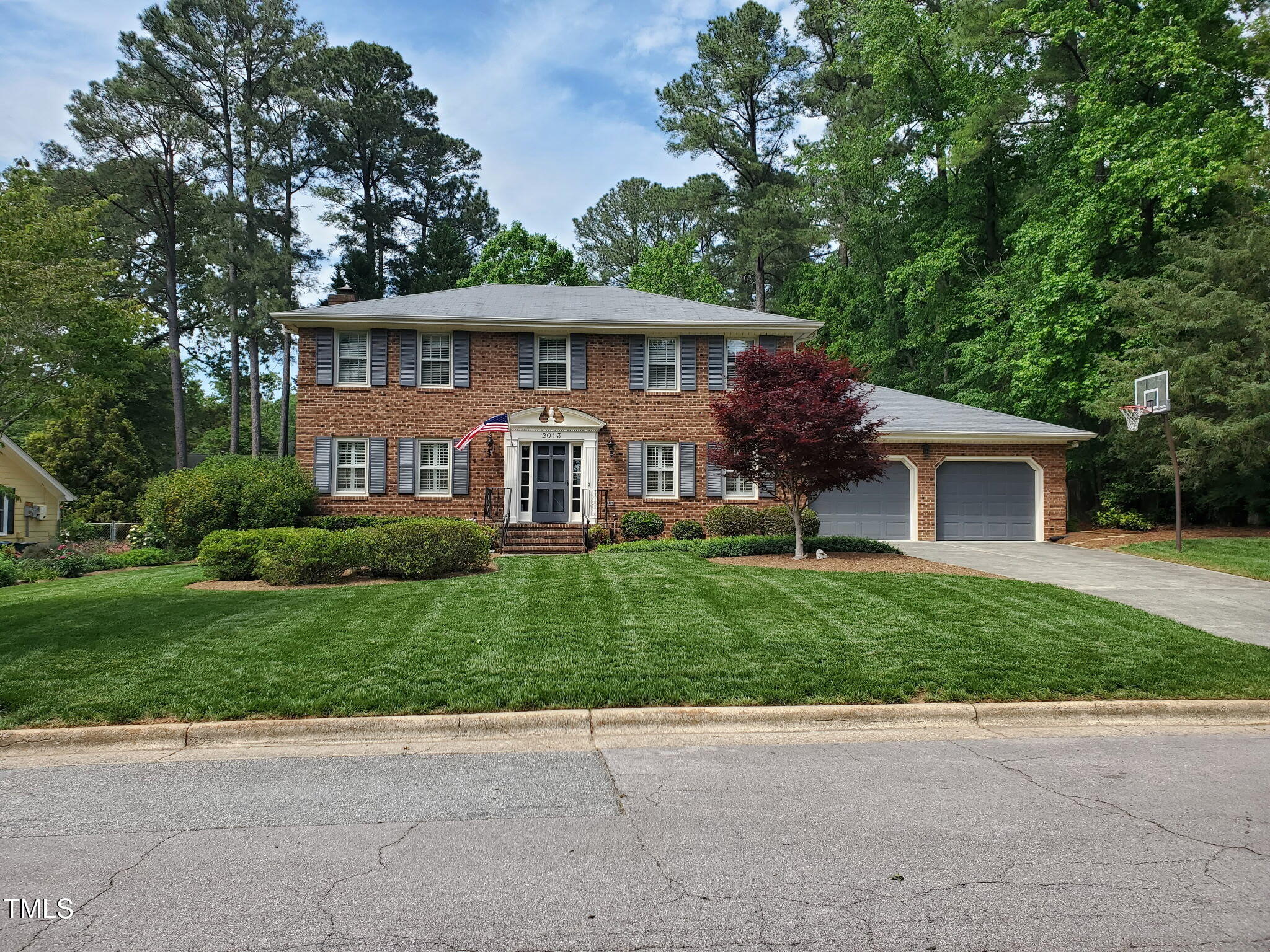 2013 Eagleton Circle Raleigh, NC 27609 - Photo 2 of 62 a front view of a house with a garden
