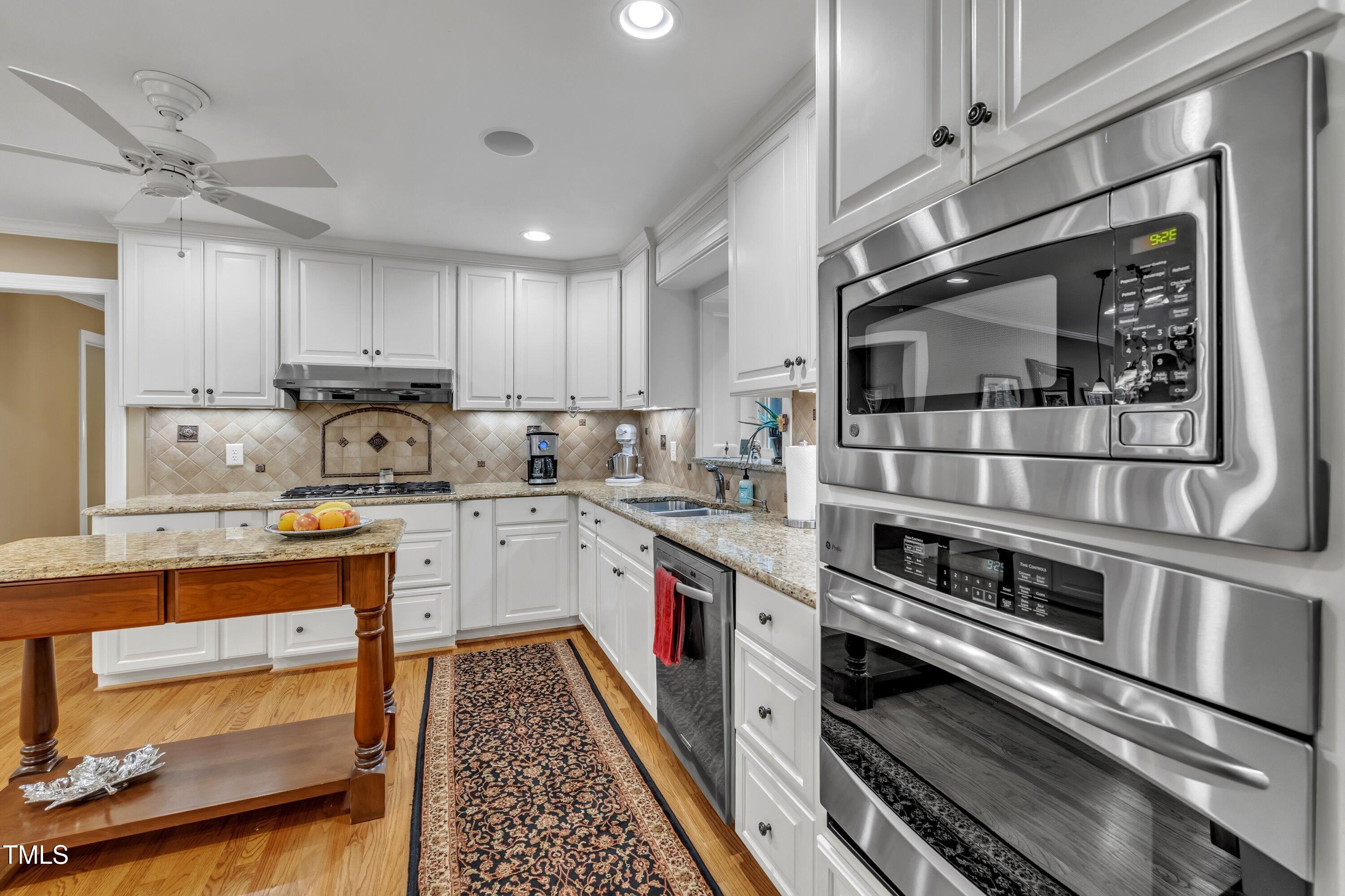 2013 Eagleton Circle Raleigh, NC 27609 - Photo 25 of 62 a kitchen with stainless steel appliances and cabinets