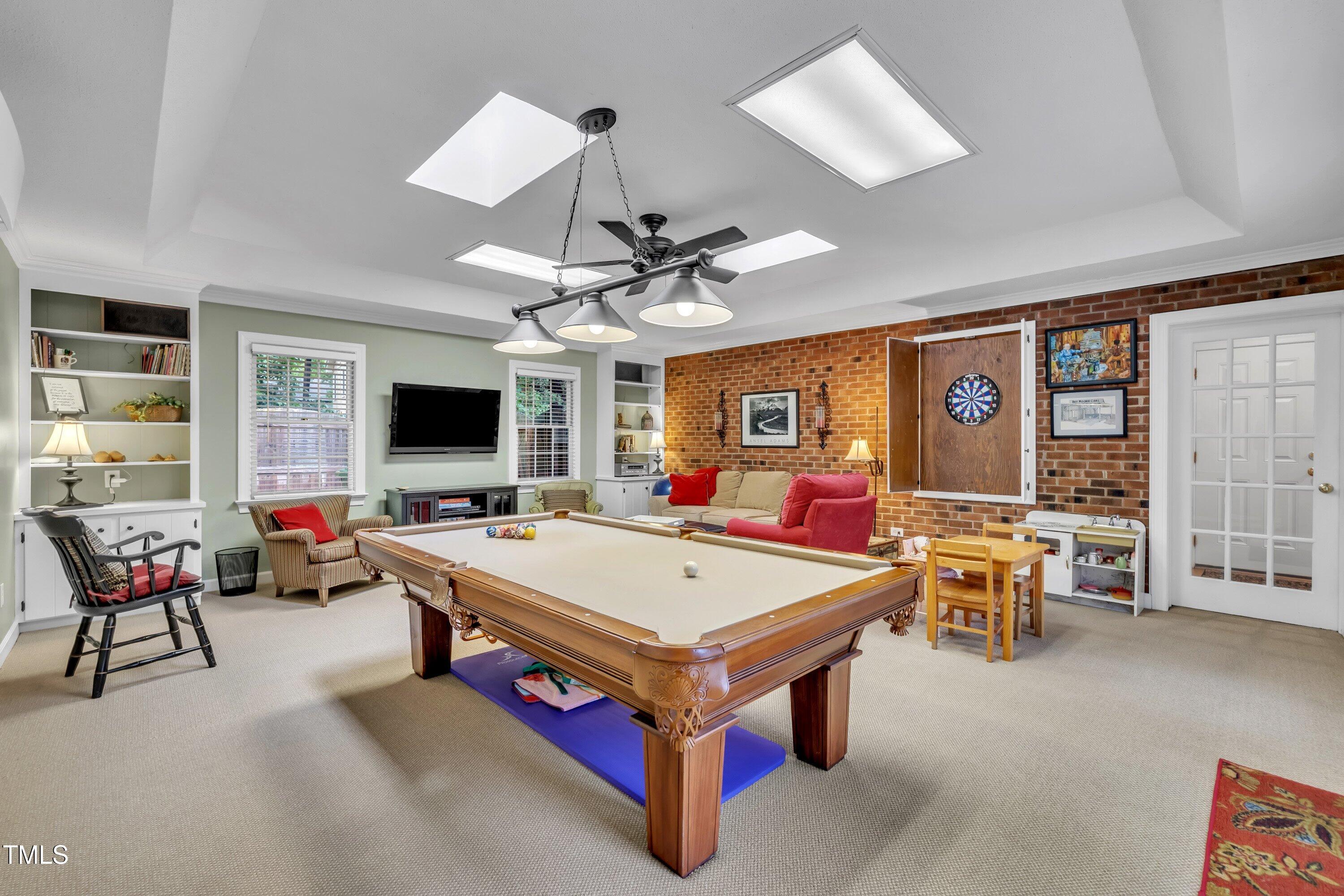 2013 Eagleton Circle Raleigh, NC 27609 - Photo 35 of 62 a living room with furniture pool table and flat screen tv