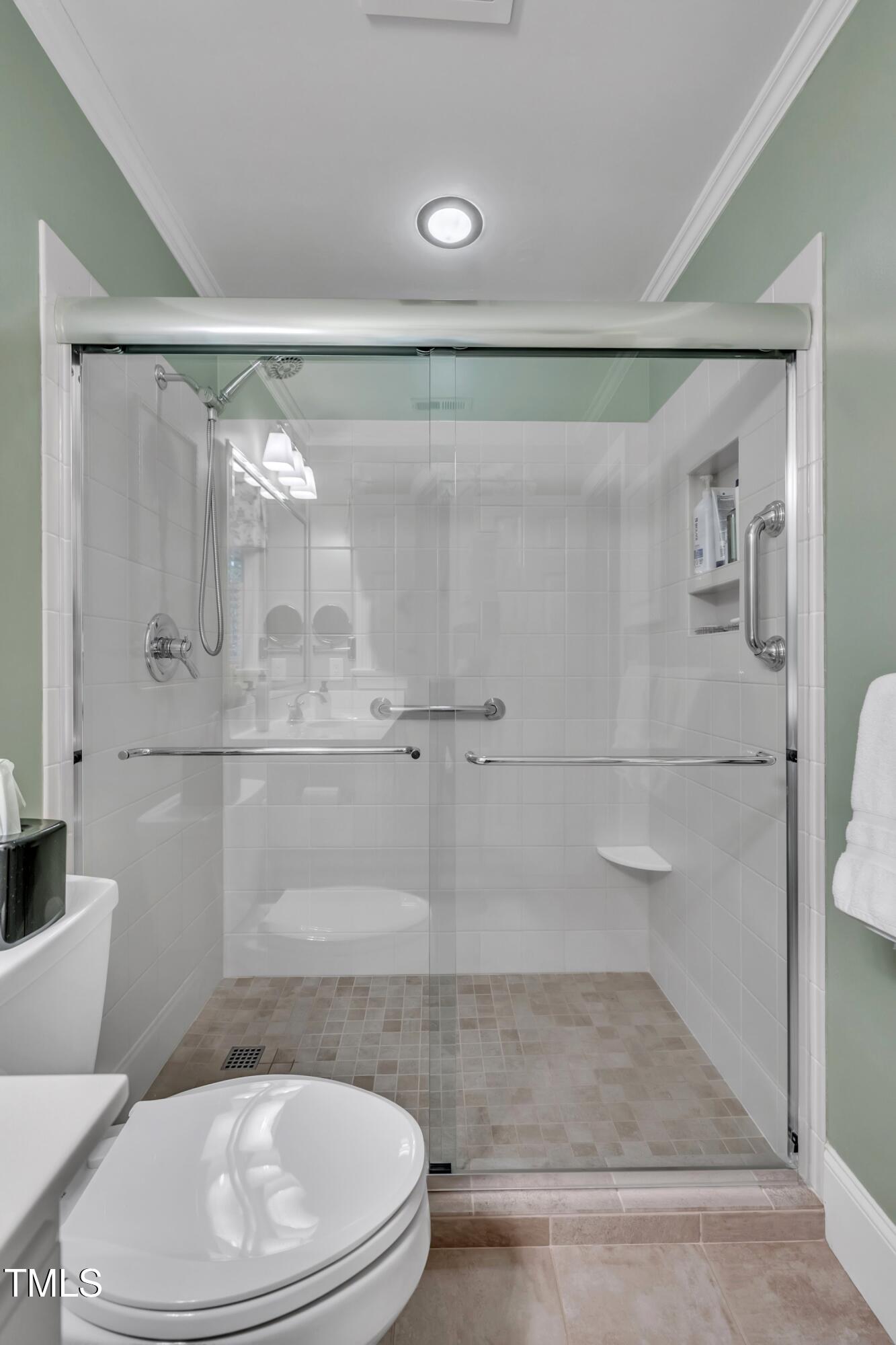 2013 Eagleton Circle Raleigh, NC 27609 - Photo 47 of 62 a bathroom with a toilet and a shower