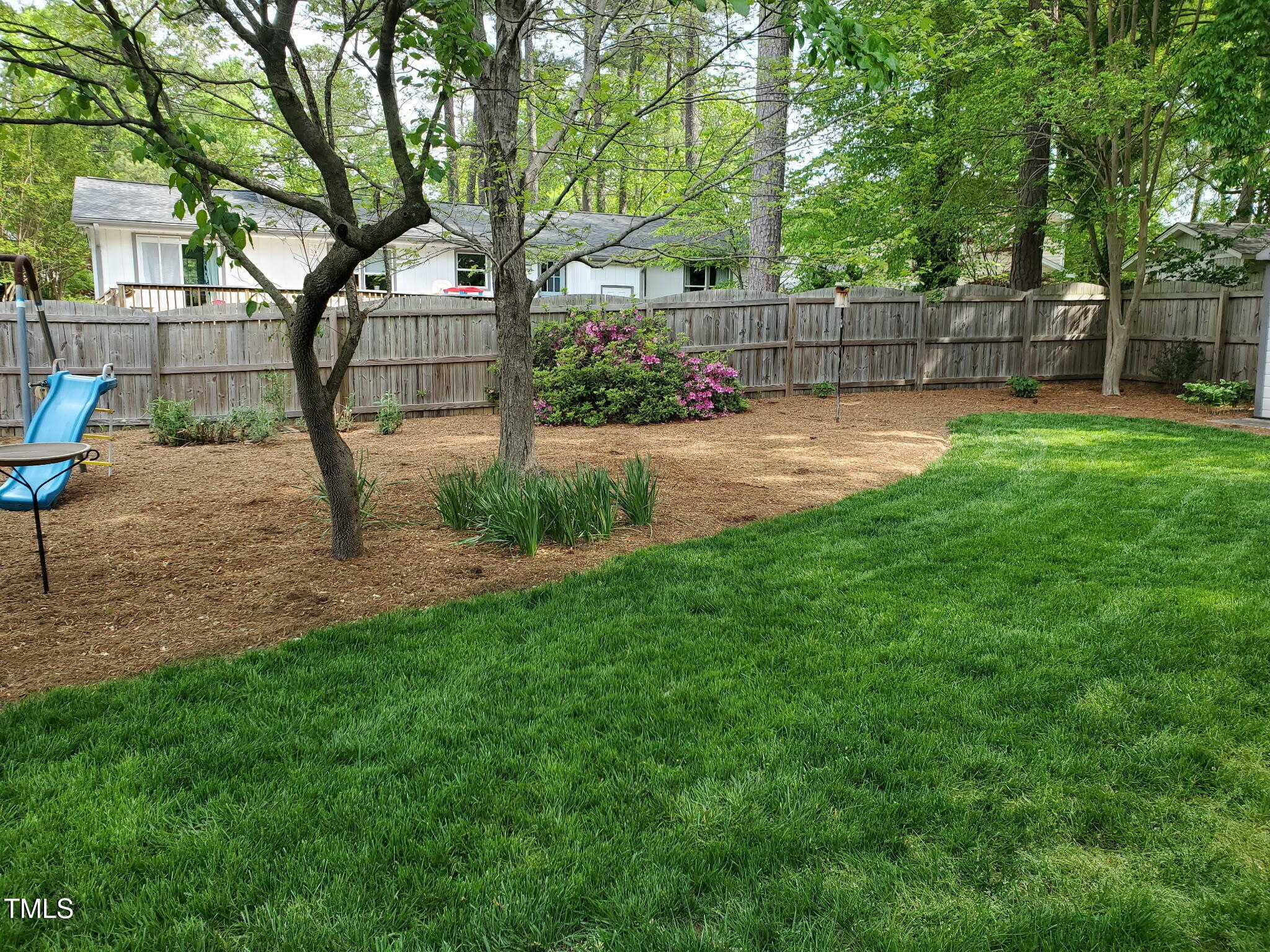 2013 Eagleton Circle Raleigh, NC 27609 - Photo 61 of 62 a view of a backyard with a garden