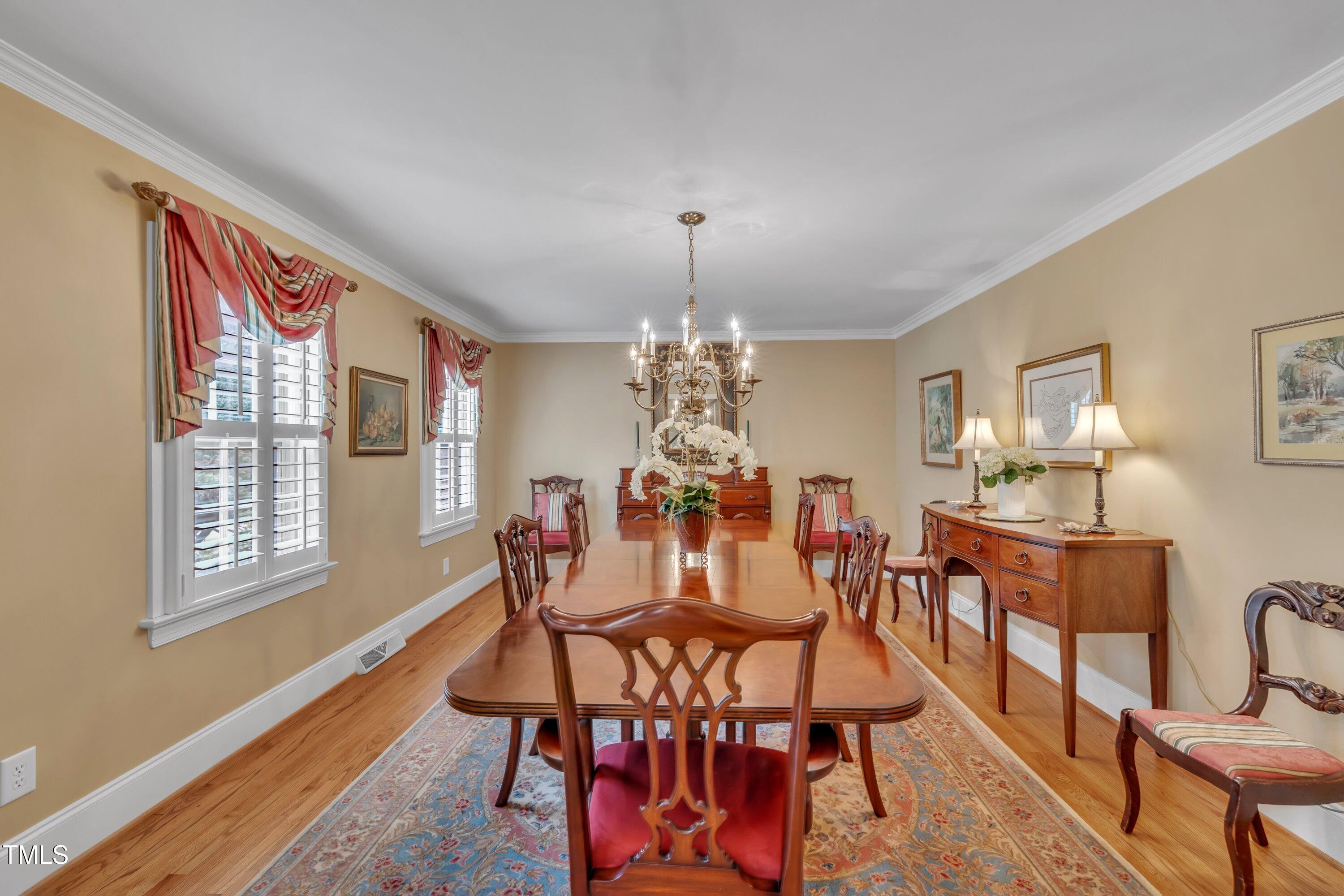 2013 Eagleton Circle Raleigh, NC 27609 - Photo 10 of 62 a view of a dining room with furniture window and wooden floor