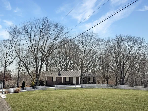 a large building with trees in front of it