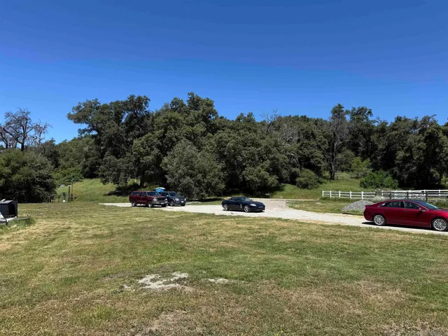 a room with water heater and racks on the wall