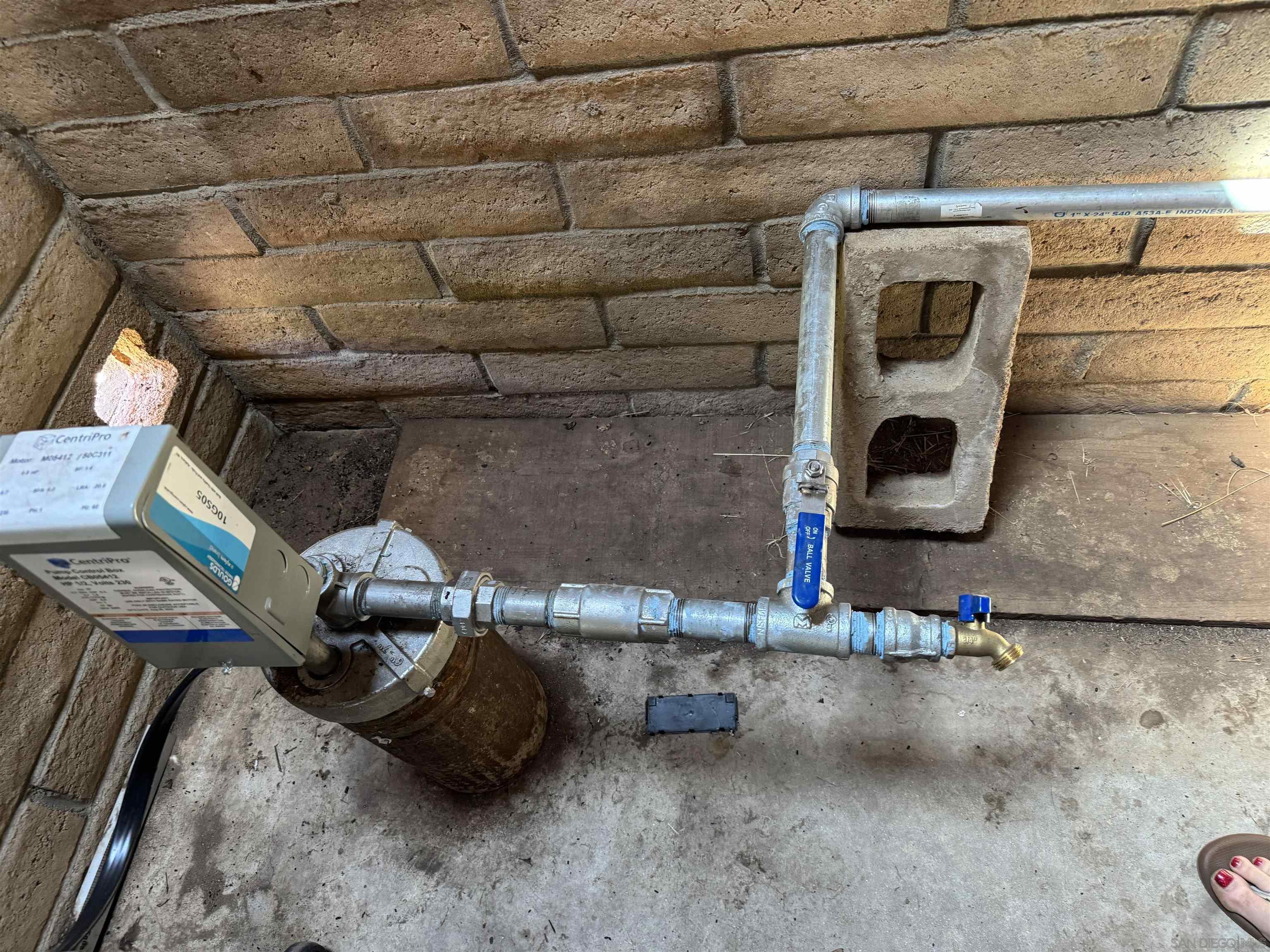 5750 Forest Meadow Road Julian, CA 92036 - Photo 22 of 39 a room with water heater and racks on the wall