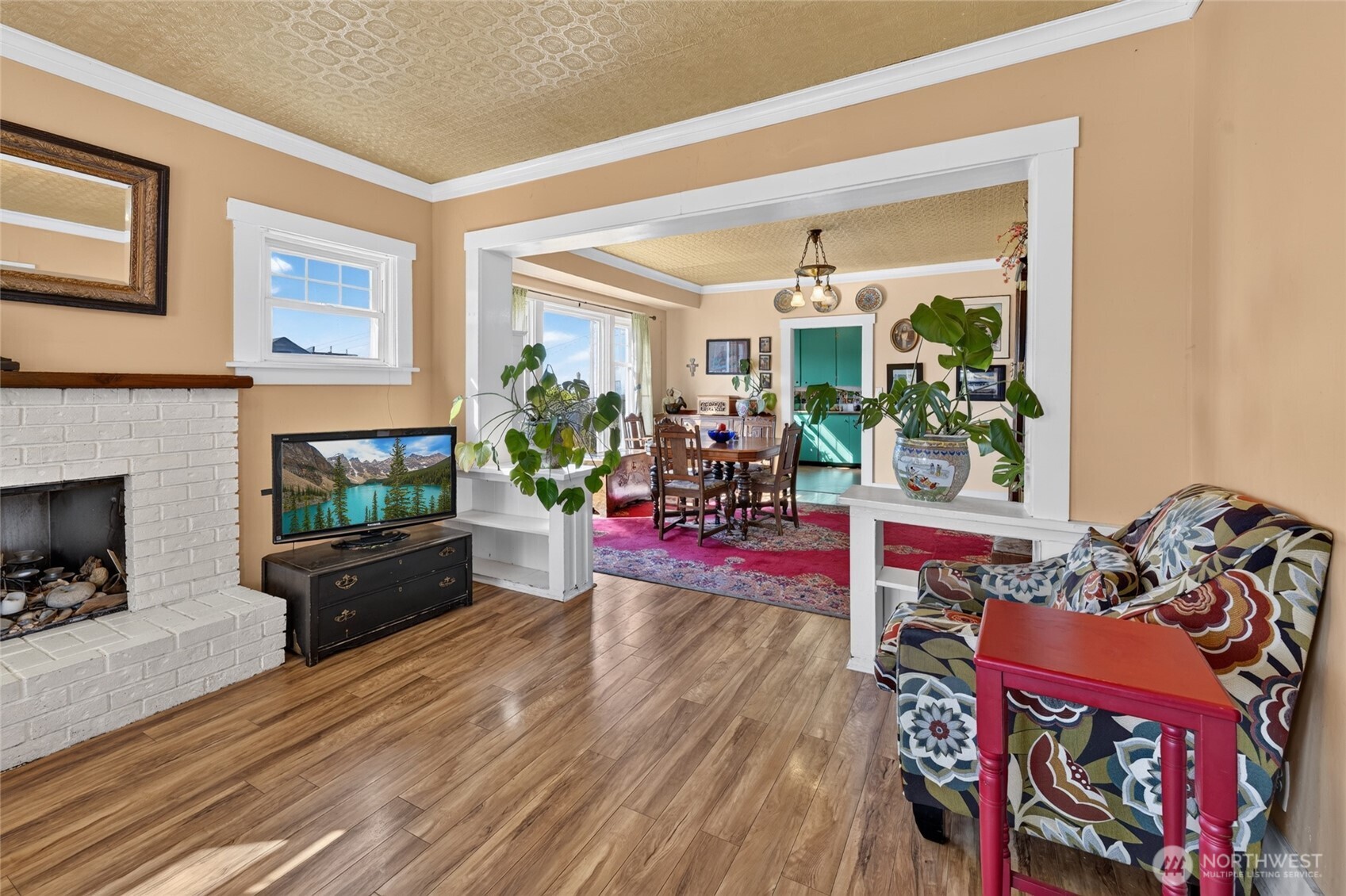 237 West 3rd Street Port Angeles, WA 98362 - Photo 9 of 40 a living room with furniture and a fireplace