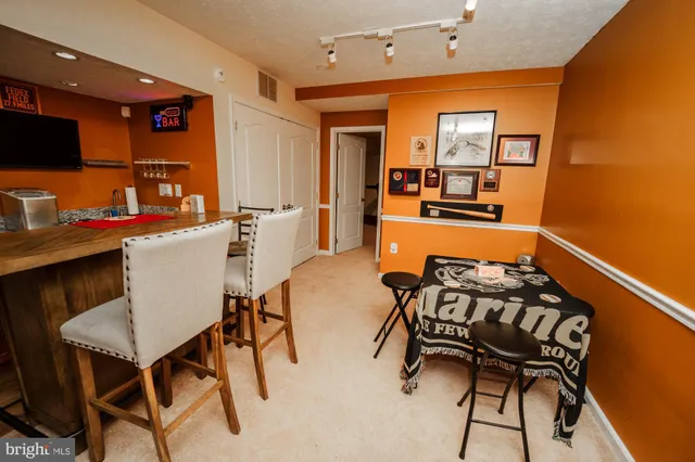 a dining room with furniture and window