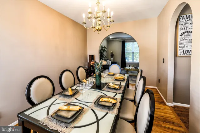 a kitchen with kitchen island granite countertop a sink stove and cabinets