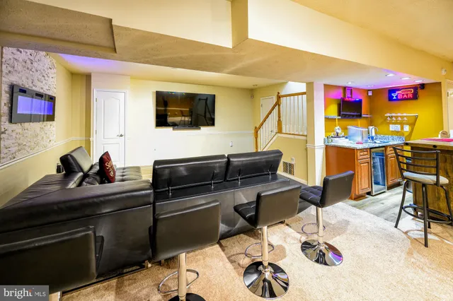 walk in closet with clothes and shoes