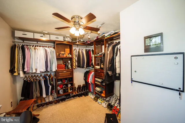 a bedroom with bed and cabinet