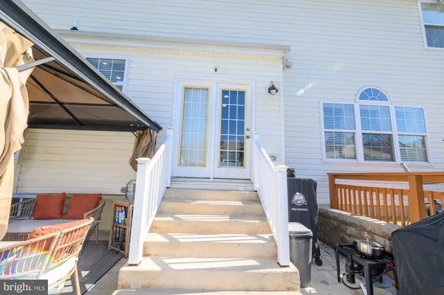 a bedroom with a bed a dresser and a flat screen tv