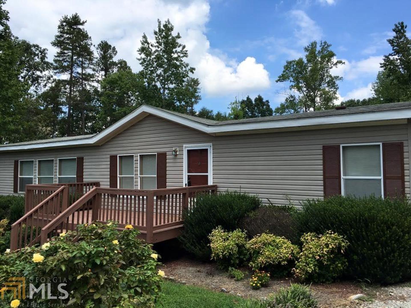 769 Wells Road Homer, GA 30547 - Photo 1 of 1 a view of a house with a yard and plants