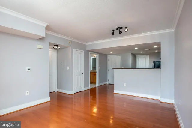 a view of kitchen with stainless steel appliances granite countertop cabinets and a refrigerator