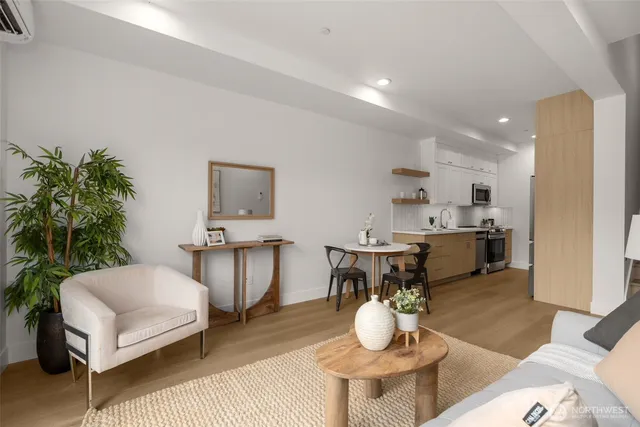 a living room with furniture and a potted plant