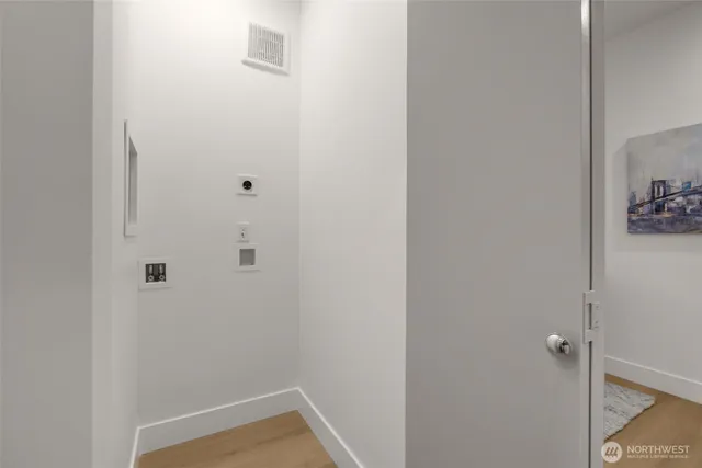 a view of a workspace with furniture and a mirror