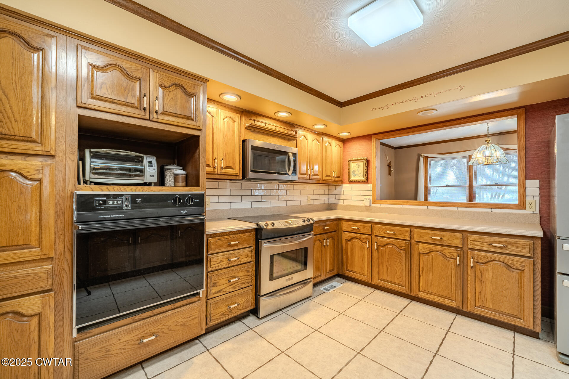 944 McKnight Street Rutherford, TN 38369 - Photo 12 of 73 a kitchen with granite countertop a stove fireplace and a microwave