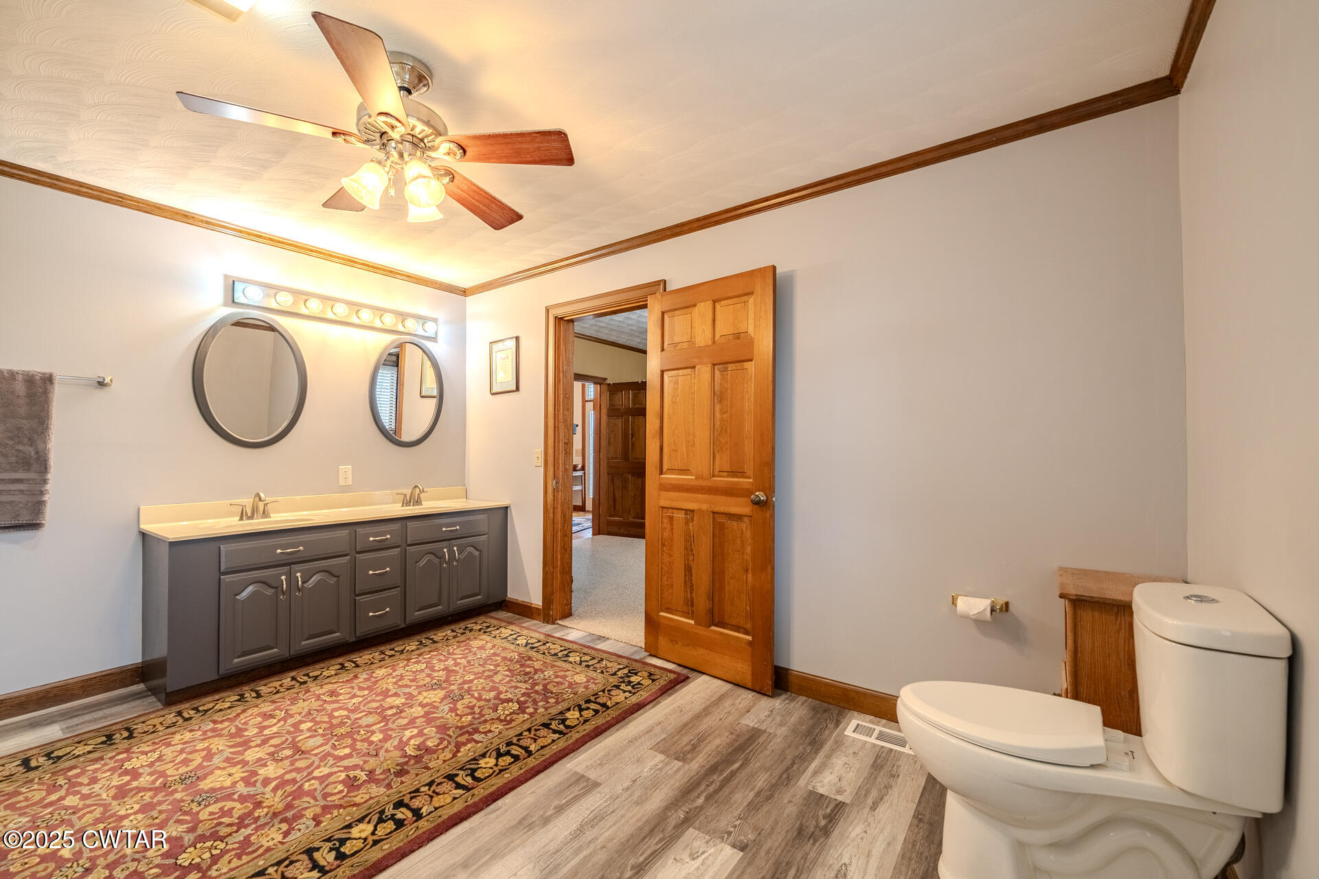 944 McKnight Street Rutherford, TN 38369 - Photo 35 of 73 a bathroom with a granite countertop sink mirror vanity and toilet
