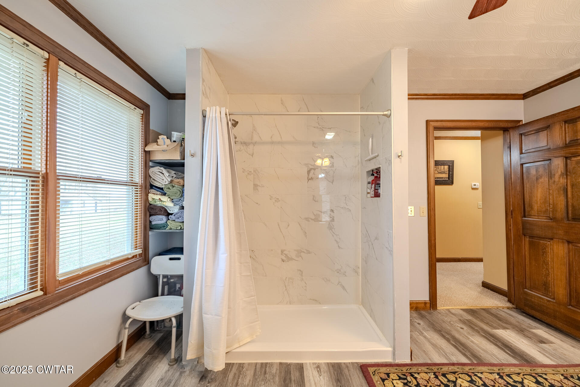 944 McKnight Street Rutherford, TN 38369 - Photo 36 of 73 a view of a bathroom with a glass door shower and a bathtub