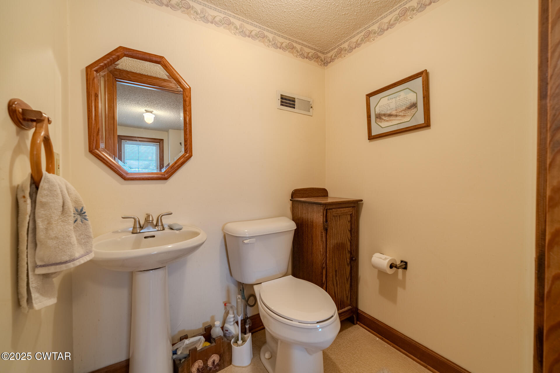 944 McKnight Street Rutherford, TN 38369 - Photo 47 of 73 a bathroom with a toilet sink and mirror