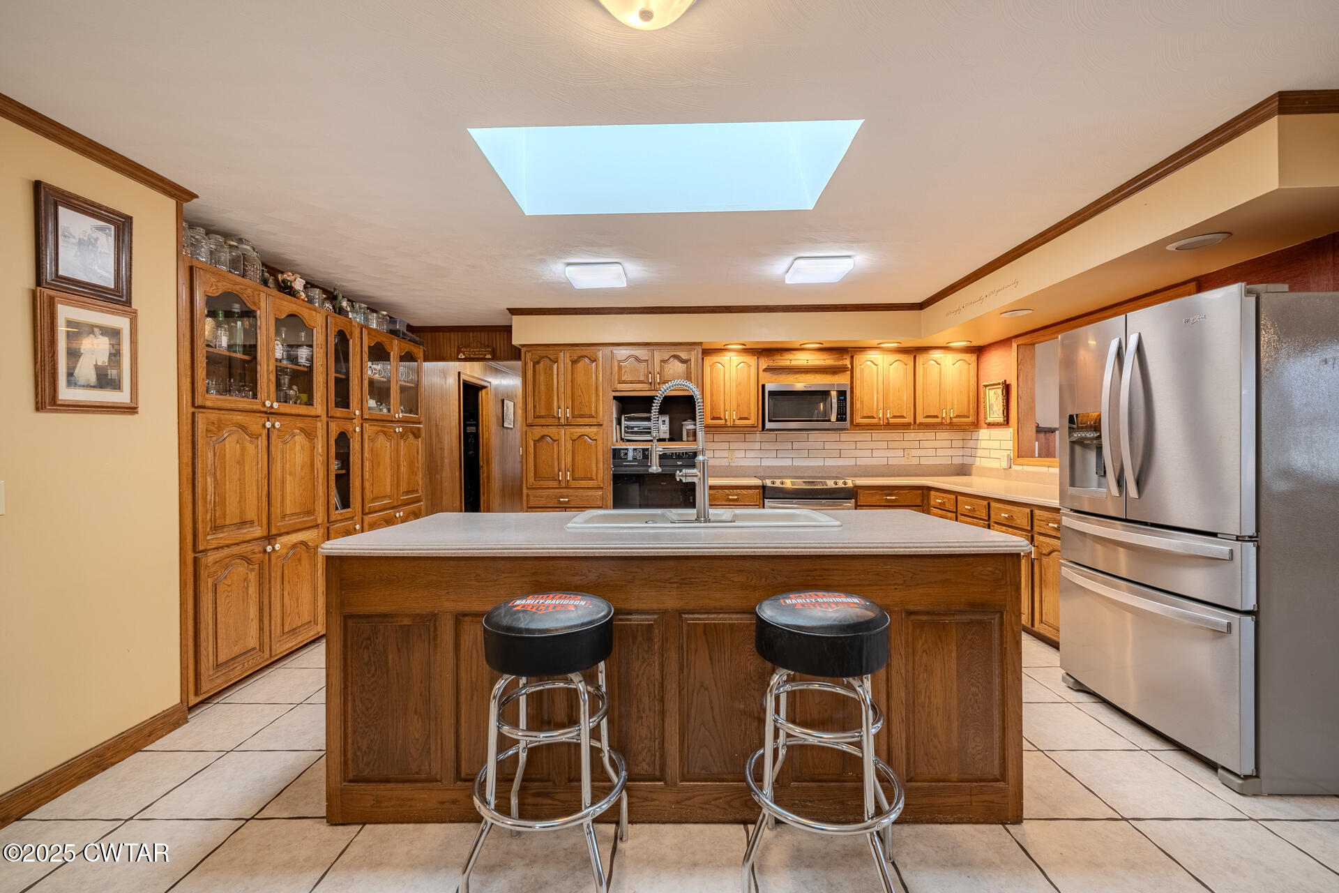 944 McKnight Street Rutherford, TN 38369 - Photo 10 of 73 a kitchen with stainless steel appliances granite countertop a table chairs sink and cabinets