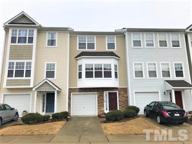 4905 Midstone Lane Raleigh, NC 27610 - Photo 1 of 22 a front view of a house with a yard